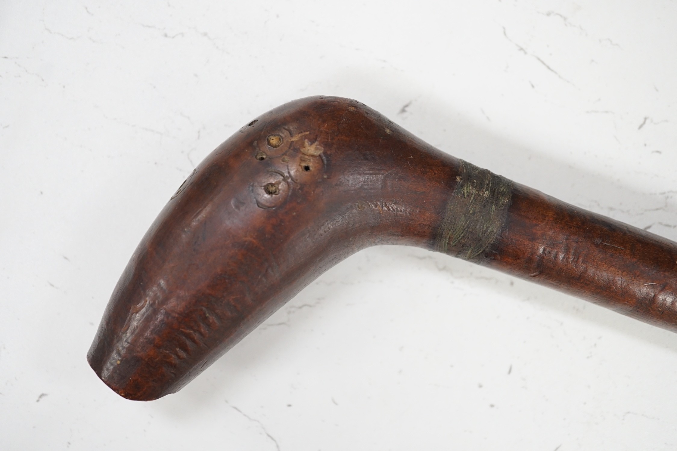 A Polynesian wood throwing club, 40cm tall